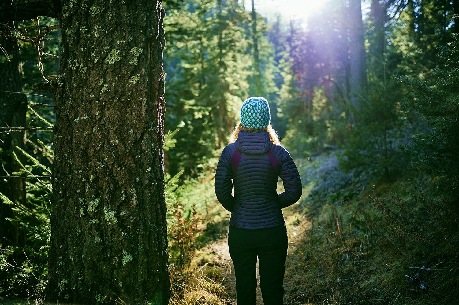 a young woman hiking in the mountains